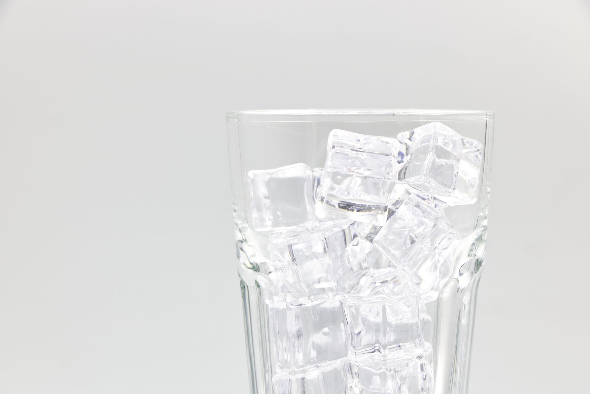 Glass of ice cubes with 'tell your midwife' overlay — visual cue for the pica section