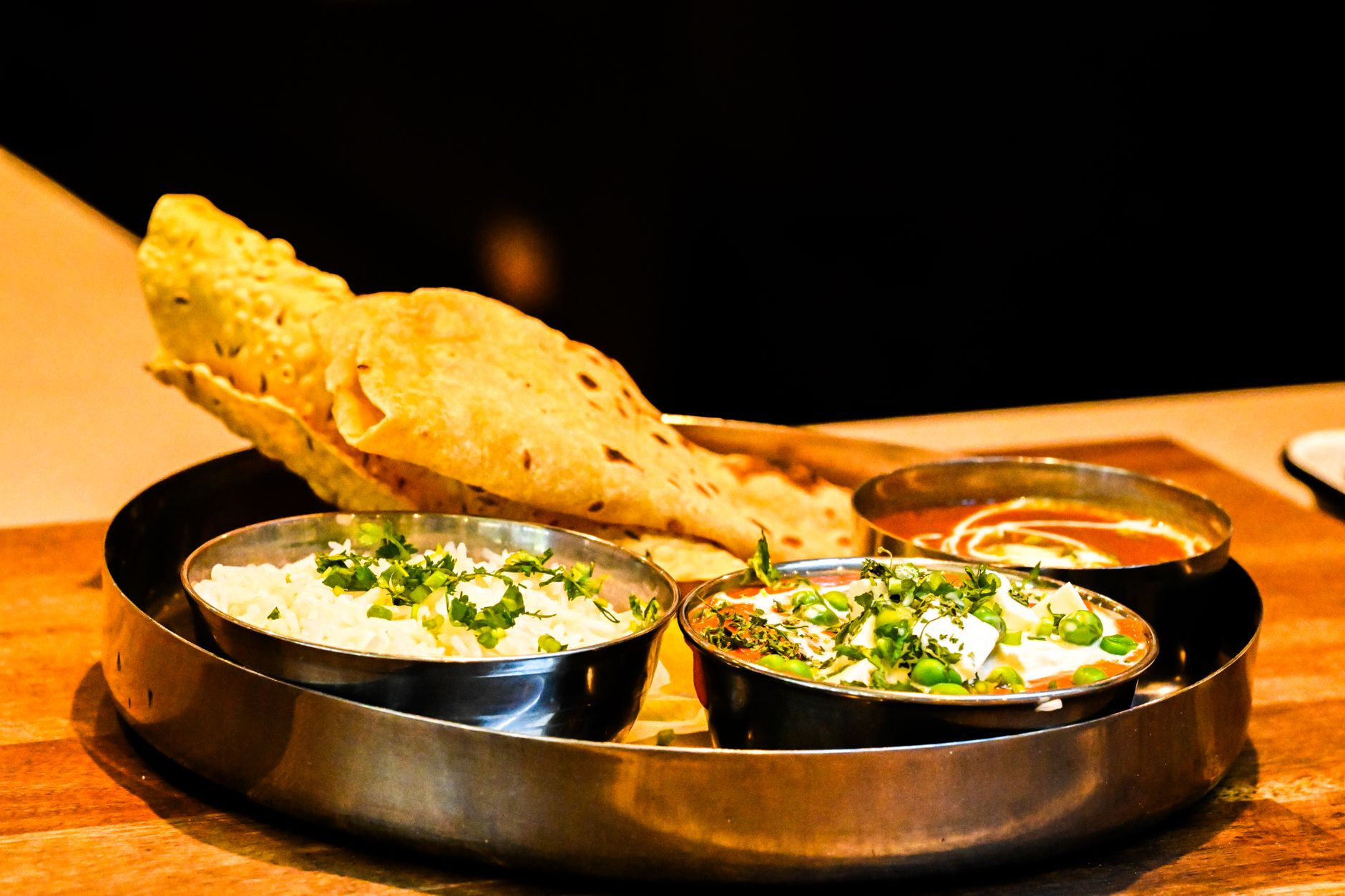 Indian vegetarian pregnancy thali: dal, paneer or tofu sabzi, ragi roti, palak, raita, salad